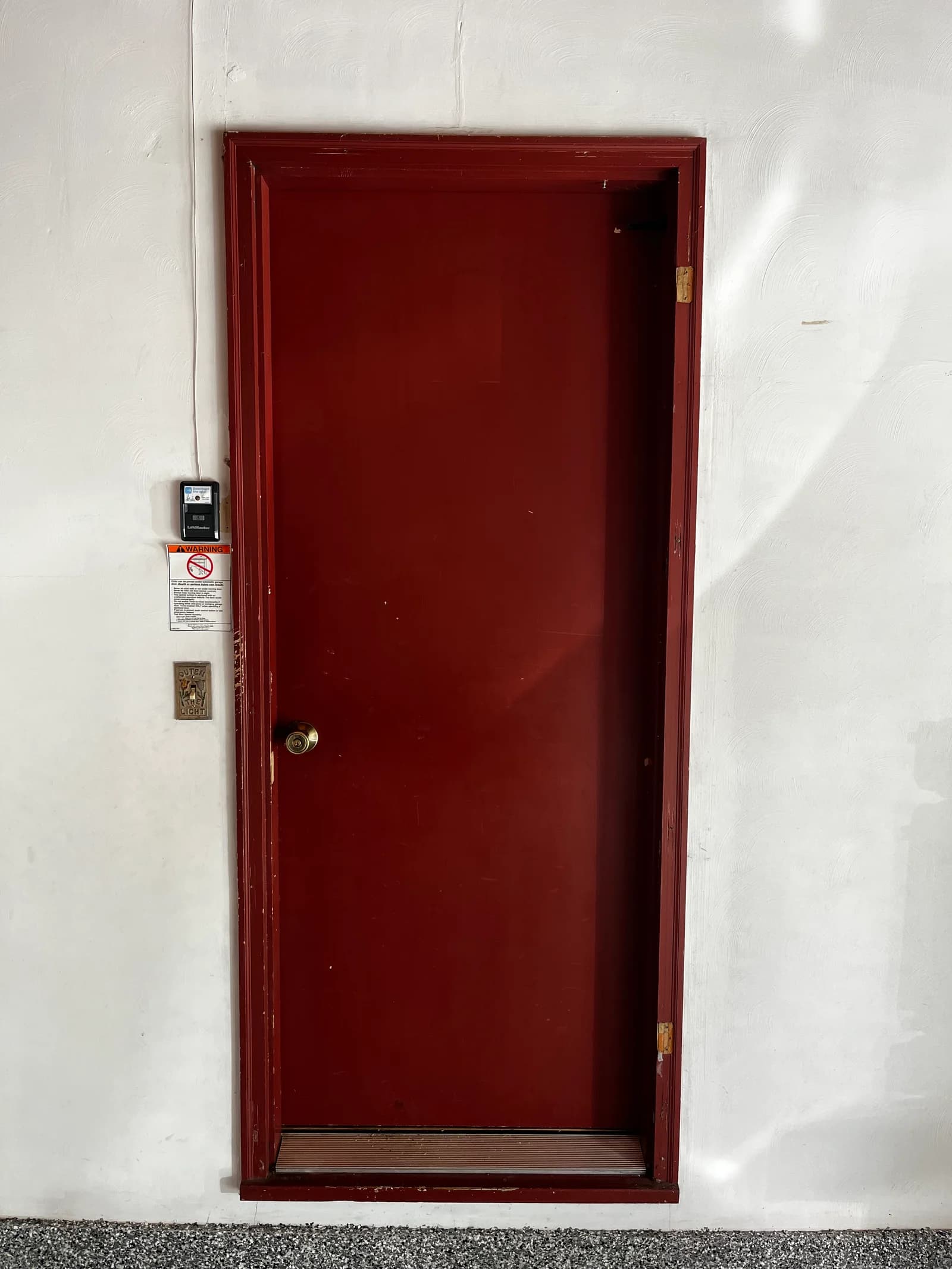 Old red entry door before replacement in Kalamazoo
